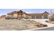 Inviting two-story home with a three-car garage and a well-manicured front yard at 7398 Weaver Cir, Castle Rock, CO 80104