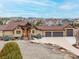 Desirable home featuring a spacious driveway and inviting curb appeal in a lovely neighborhood at 7398 Weaver Cir, Castle Rock, CO 80104