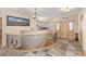 Welcoming entryway with curved staircase and warm natural lighting at 7398 Weaver Cir, Castle Rock, CO 80104