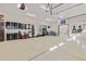 Spacious garage with epoxy flooring, storage cabinets, and ample space for vehicles and equipment at 7398 Weaver Cir, Castle Rock, CO 80104