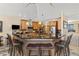 Well-equipped kitchen featuring an island with bar seating, custom cabinetry, and granite countertops at 7398 Weaver Cir, Castle Rock, CO 80104