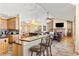 Open-concept kitchen and living area perfect for entertaining, featuring stone floors and high ceilings at 7398 Weaver Cir, Castle Rock, CO 80104
