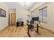 Comfortable office space with hardwood flooring, a rolling chair, and natural light at 7398 Weaver Cir, Castle Rock, CO 80104
