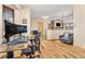 Functional home office with hardwood floors, natural light, and a comfortable workspace at 7398 Weaver Cir, Castle Rock, CO 80104