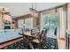 Elegant dining area with stylish chandelier, hardwood floors, and easy access to outdoor deck at 4285 Corte Bella Dr, Broomfield, CO 80023