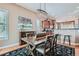 Chic dining area featuring a modern chandelier, hardwood floors, and seamless flow to the kitchen at 4285 Corte Bella Dr, Broomfield, CO 80023