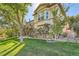 Stunning exterior view of the home featuring a walkout deck and well-maintained landscaping at 4285 Corte Bella Dr, Broomfield, CO 80023