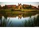 Exterior of the house showcasing a pond view and a well-maintained lawn at 4285 Corte Bella Dr, Broomfield, CO 80023