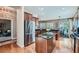 Modern kitchen featuring stainless steel appliances, granite countertops, and a center island with a breakfast bar at 4285 Corte Bella Dr, Broomfield, CO 80023