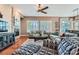 Bright and inviting living room with a cozy fireplace, hardwood floors, and comfortable sofas at 4285 Corte Bella Dr, Broomfield, CO 80023