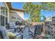 Relax on this backyard deck featuring ample seating, a table, and an umbrella for shade at 4285 Corte Bella Dr, Broomfield, CO 80023