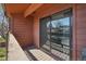 View of a cozy balcony featuring wood flooring, sliding glass doors, and natural light at 540 S Forest St # 3-204, Denver, CO 80246