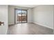 Spacious bedroom with hardwood floors, a sliding glass door to balcony and lots of natural light at 540 S Forest St # 3-204, Denver, CO 80246