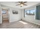 Bedroom with hardwood floors, a ceiling fan, and a large window at 540 S Forest St # 3-204, Denver, CO 80246
