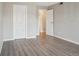 Bright bedroom with hardwood floors and neutral paint provides a peaceful retreat at 540 S Forest St # 3-204, Denver, CO 80246