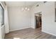 Bright dining room features hardwood floors, contemporary chandelier, and easy access to kitchen appliances at 540 S Forest St # 3-204, Denver, CO 80246