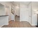 Bright entryway featuring stairs, a front door, a neutral color scheme, and light wood floors at 540 S Forest St # 3-204, Denver, CO 80246