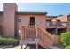 Condo exterior features wood siding, stairs to the front door, and some landscaping around the property at 540 S Forest St # 3-204, Denver, CO 80246