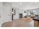 Spacious living room with modern furniture, a cozy fireplace, and bright natural lighting at 540 S Forest St # 3-204, Denver, CO 80246
