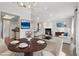 Open-concept living area with a fireplace, kitchen view, and dining table setup, ideal for entertaining at 540 S Forest St # 3-204, Denver, CO 80246