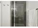 Sleek shower featuring gray tiling, a glass enclosure, and modern fixtures at 540 S Forest St # 3-204, Denver, CO 80246