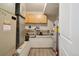 Functional utility room with storage cabinets, shelving, and visible mechanical systems at 540 S Forest St # 3-204, Denver, CO 80246