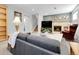 Cozy basement featuring a fireplace, comfortable seating, and a TV for entertainment, perfect for relaxation at 6810 S Marion W Cir, Centennial, CO 80122