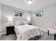 Bedroom with windows and side tables, featuring a bed and neutral colors at 6810 S Marion W Cir, Centennial, CO 80122