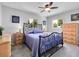 Comfortable bedroom with two windows, ceiling fan and closet space at 6810 S Marion W Cir, Centennial, CO 80122