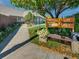 Private club entrance with a sign, flowers, and a bench at 6810 S Marion W Cir, Centennial, CO 80122