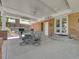 Charming covered patio featuring an outdoor dining set, grill, and access to the landscaped backyard at 6810 S Marion W Cir, Centennial, CO 80122