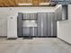 Spacious garage with wall mounted storage cabinets and drawers, keeping everything organized and easily accessible at 6810 S Marion W Cir, Centennial, CO 80122