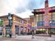 Shops and restaurants in the town center, with outdoor seating available at 6810 S Marion W Cir, Centennial, CO 80122