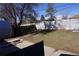 Backyard featuring a grass lawn, a tree, a wood fence, and a shed at 9191 Russell Way, Thornton, CO 80229