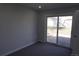 Bedroom featuring carpet floors and glass sliding doors leading outside at 9191 Russell Way, Thornton, CO 80229