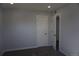 Bedroom featuring neutral paint, carpet, base trim, door and closet at 9191 Russell Way, Thornton, CO 80229