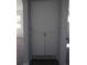 Hallway linen storage cabinet with full height and base cabinets and finished in a neutral color at 9191 Russell Way, Thornton, CO 80229