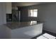 Bright kitchen with granite countertops, stainless steel appliances and an open concept design at 9191 Russell Way, Thornton, CO 80229