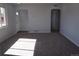 Bright living room featuring an open floorplan, neutral paint colors and arched doorways at 9191 Russell Way, Thornton, CO 80229