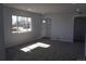 Bright living room featuring an open floorplan, neutral paint colors and arched doorways at 9191 Russell Way, Thornton, CO 80229