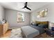 This bedroom has hardwood floors and a neutral color scheme. The room is brightly lit with natural light at 1535 Hudson St # 1, Denver, CO 80220