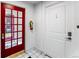 An entryway featuring tiled floors and a bright red door with glass panels at 1535 Hudson St # 1, Denver, CO 80220