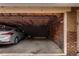 A garage with a silver car inside, showcasing the available parking and storage space at 1535 Hudson St # 1, Denver, CO 80220