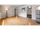 Bright living room showcasing hardwood floors, archways, and an adjacent kitchen at 1535 Hudson St # 1, Denver, CO 80220