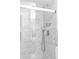 Modern bathroom with marble tile, glass shower door, and sleek fixtures at 4100 Shaw Blvd, Westminster, CO 80031
