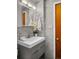 Chic bathroom with marble walls, modern vanity and stylish fixtures at 4100 Shaw Blvd, Westminster, CO 80031