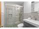 Elegant bathroom with a frameless glass shower, decorative tile, and modern fixtures at 4100 Shaw Blvd, Westminster, CO 80031