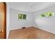 Inviting bedroom with hardwood flooring, two large windows, and ample natural light at 4100 Shaw Blvd, Westminster, CO 80031