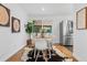 Cozy dining area featuring stylish decor, a stainless steel refrigerator, and great lighting at 4100 Shaw Blvd, Westminster, CO 80031