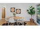 Dining room featuring a modern table with seating, stylish decor, and hardwood flooring at 4100 Shaw Blvd, Westminster, CO 80031